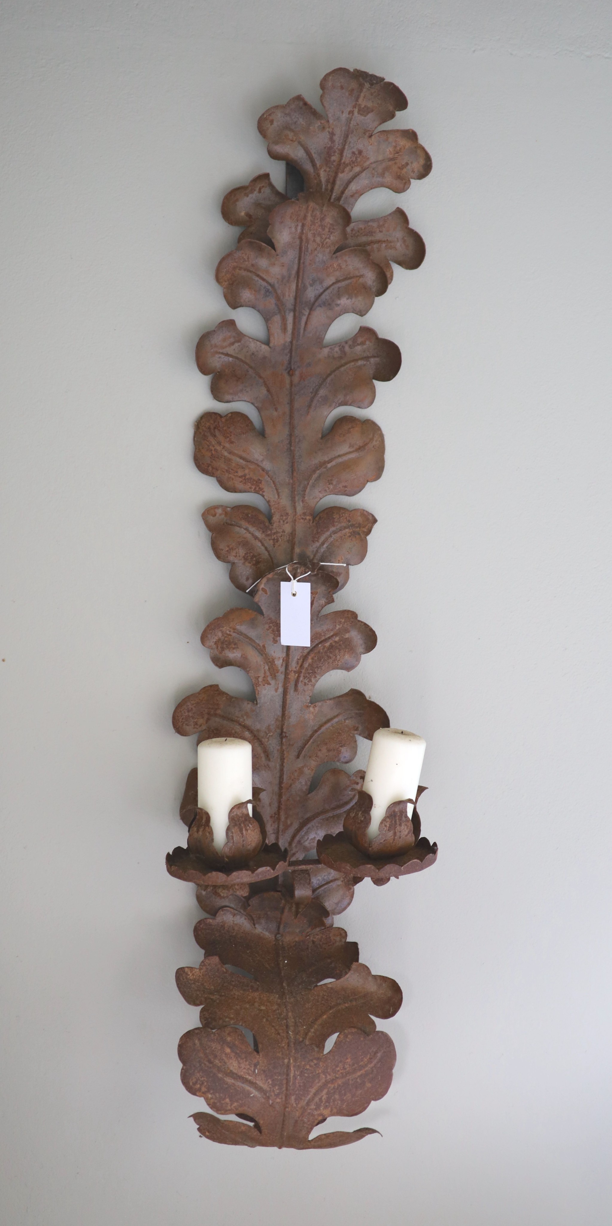 A pair of oxidised metal acanthus leaf wall sconces, width 30cm height 118cm